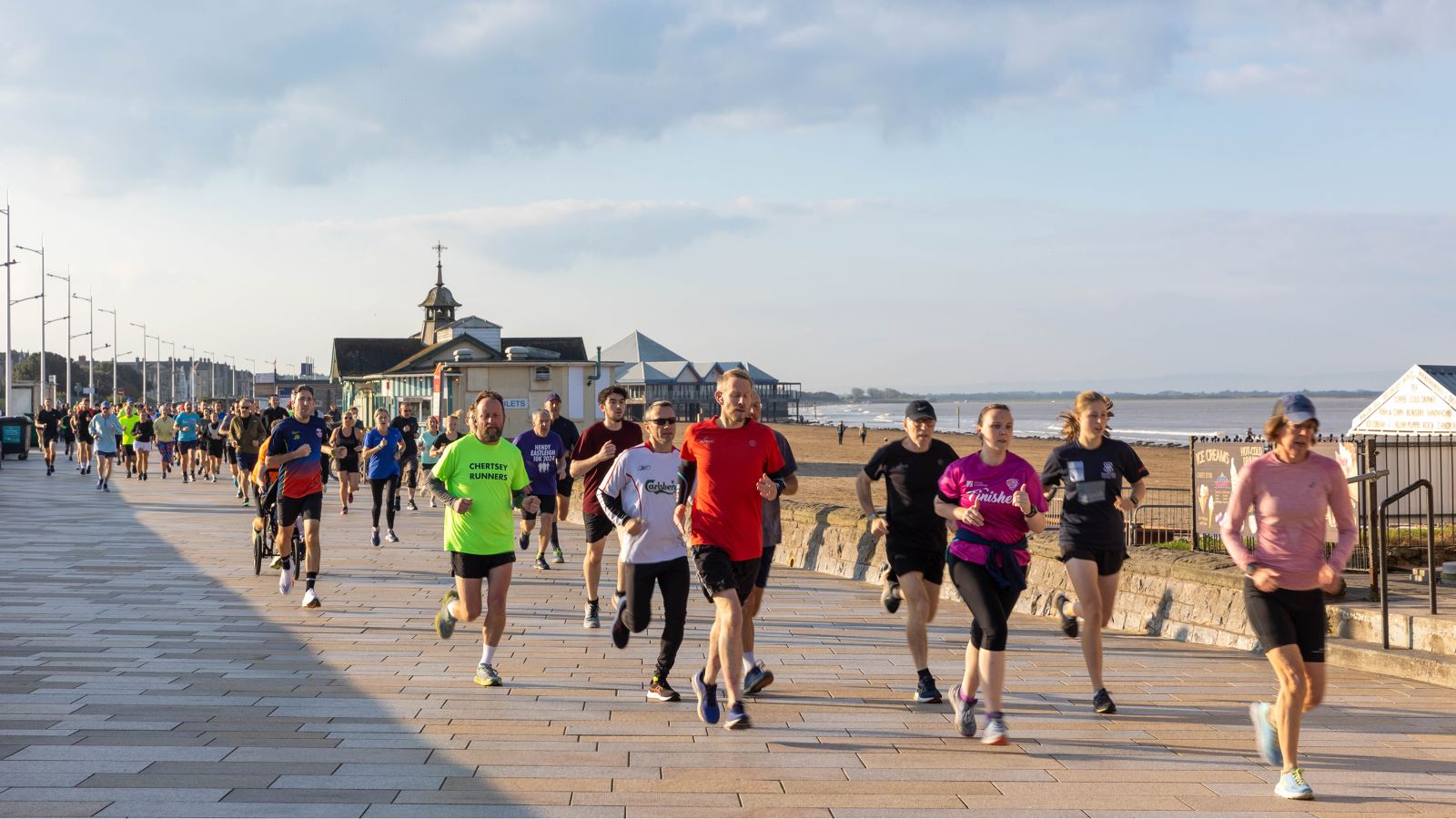 A large crowd of runners on Weston promenade taking part in the weekly Weston-super-Mare seafront Park Runt 